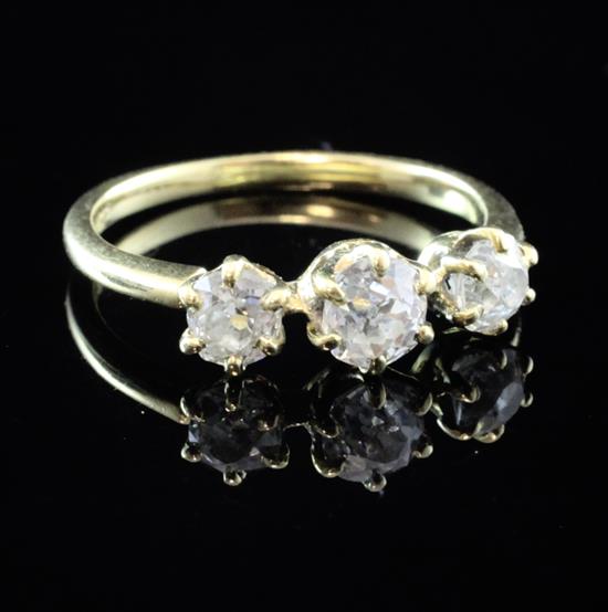 An 18ct gold and three stone diamond ring, size P.